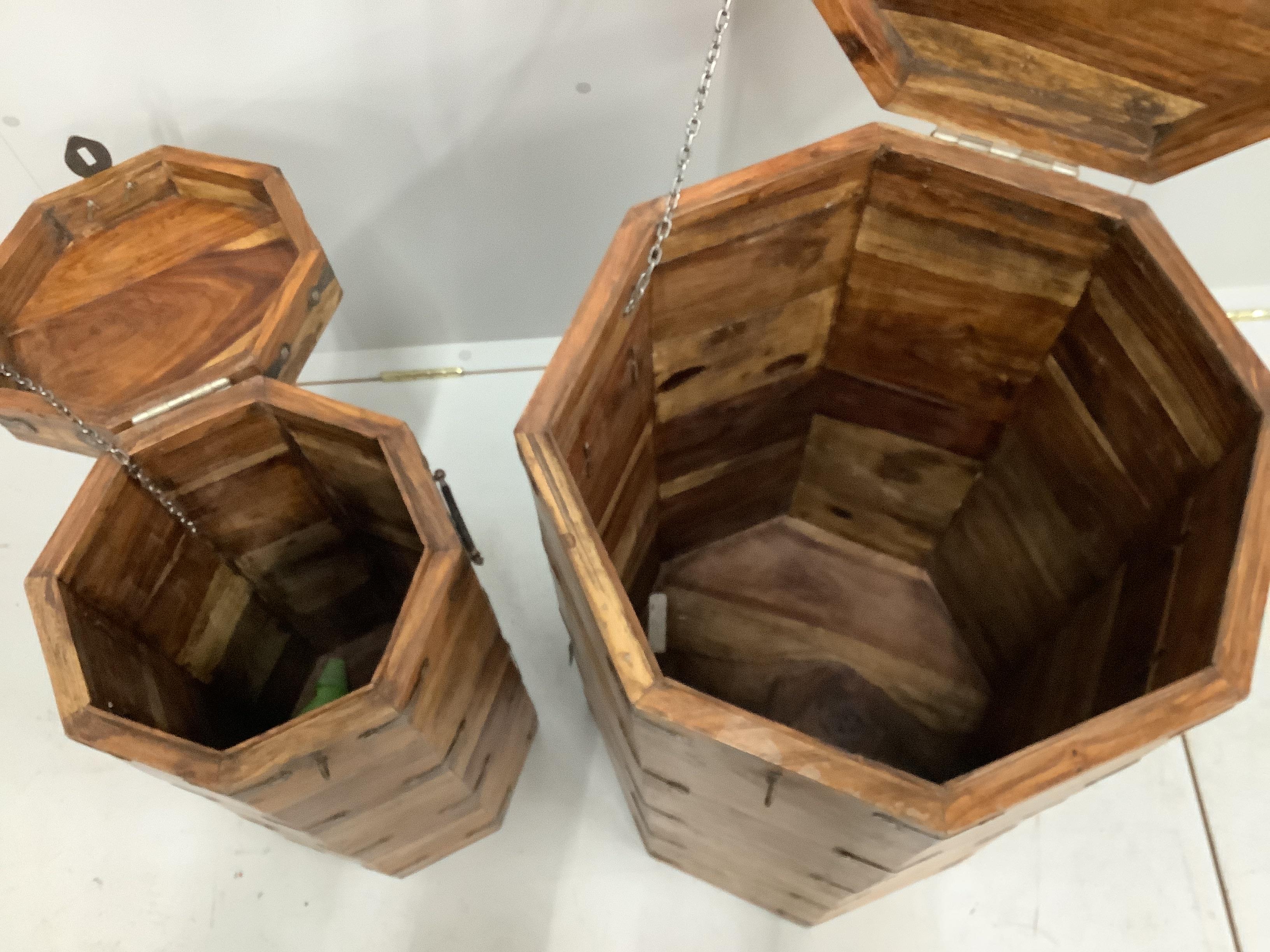Two Indian metal mounted octagonal hardwood boxes, larger width 45cm, height 77cm